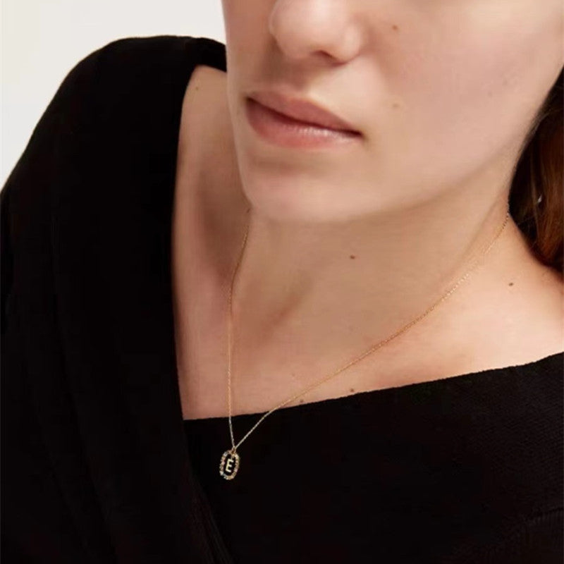 Personalized Gemstone Initial Necklace A Symbol of Uniqueness